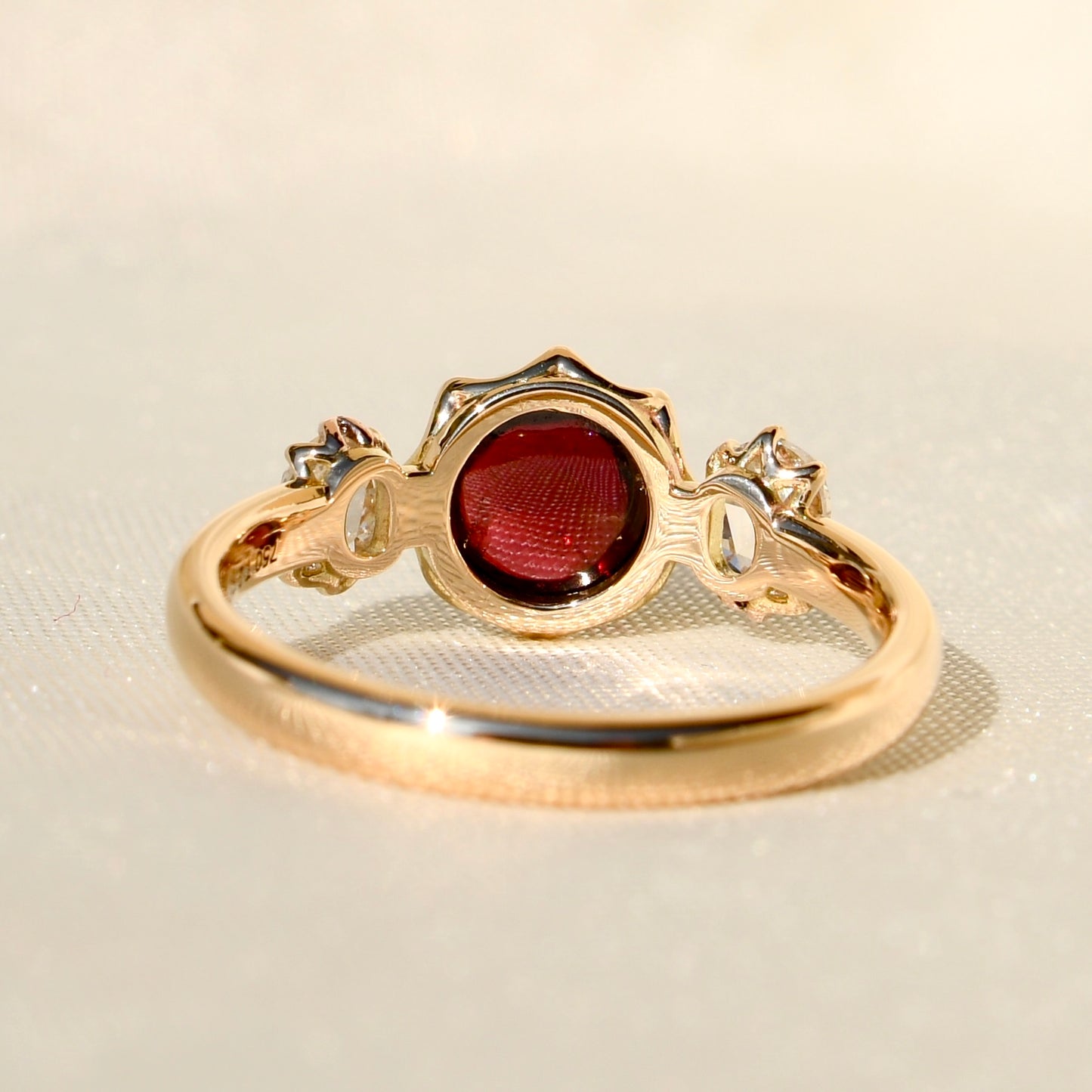 2.15 ct tourmaline cabochon and rose cut diamond three stone ring