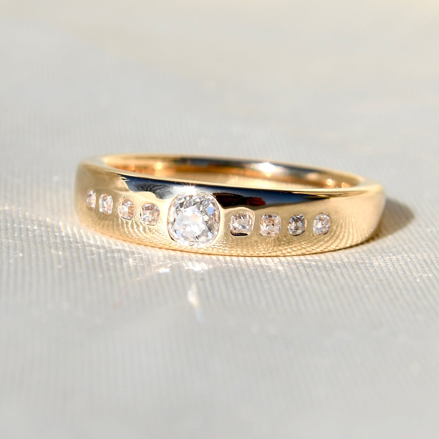 0.38 ct peruzzi cut diamond nine stone band ring