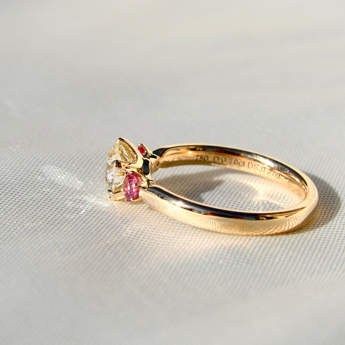 0.78 ct transitional cut diamond and spinel three stone ring