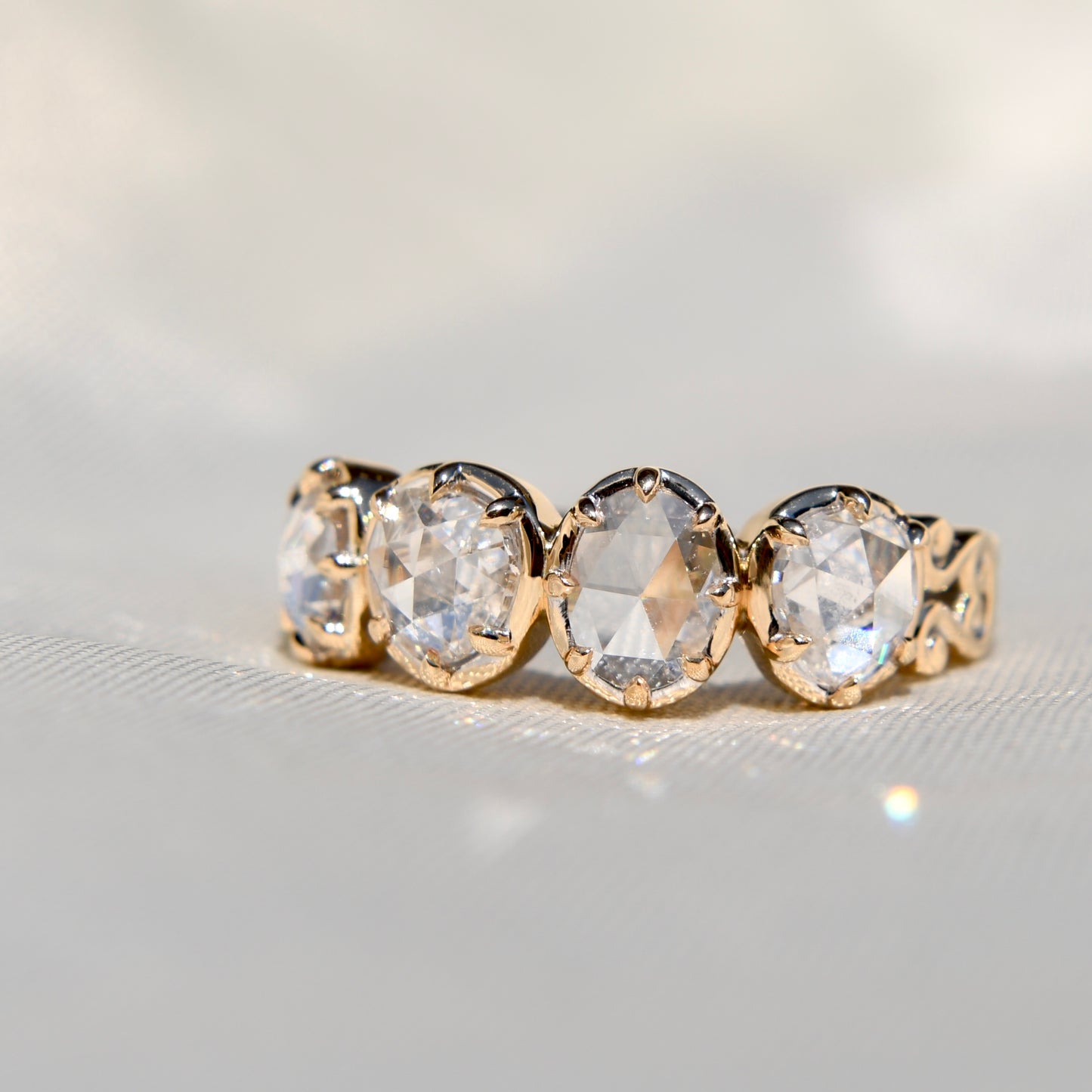 1.30 ct rose cut diamond four stone band ring