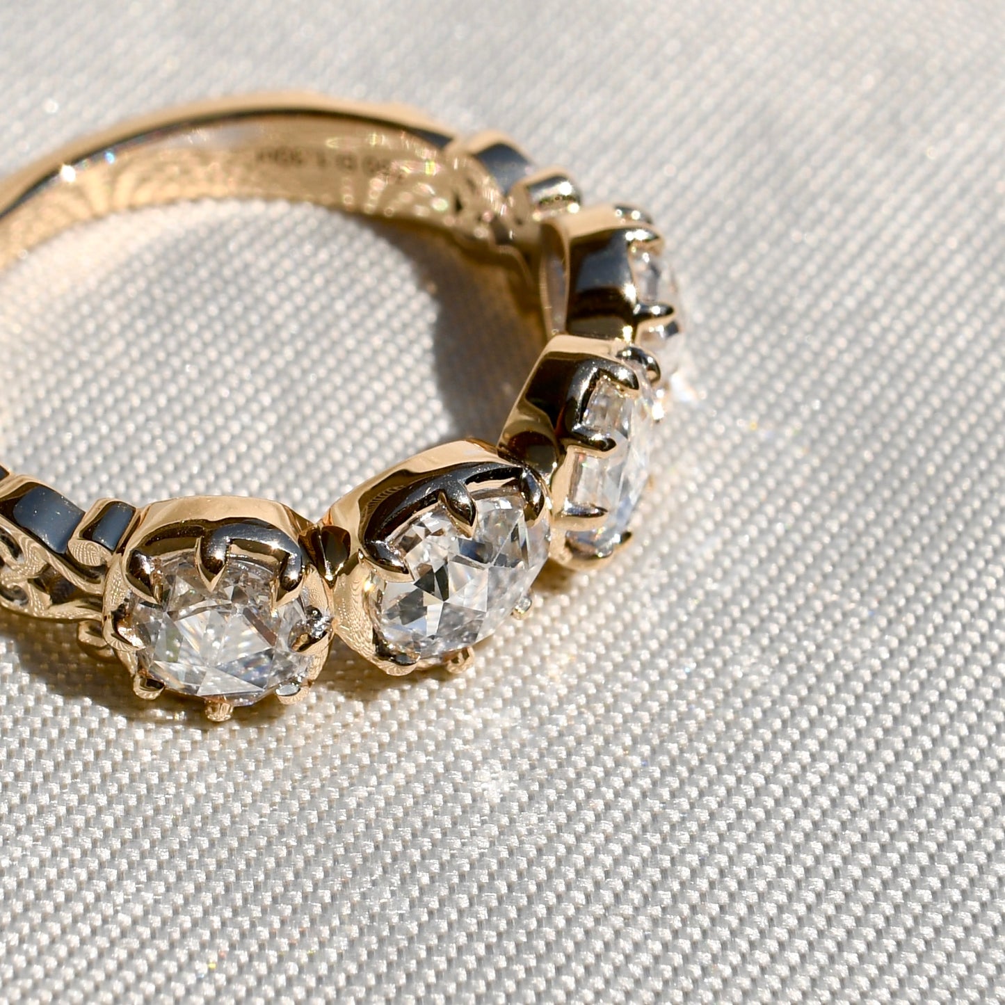 1.30 ct rose cut diamond four stone band ring