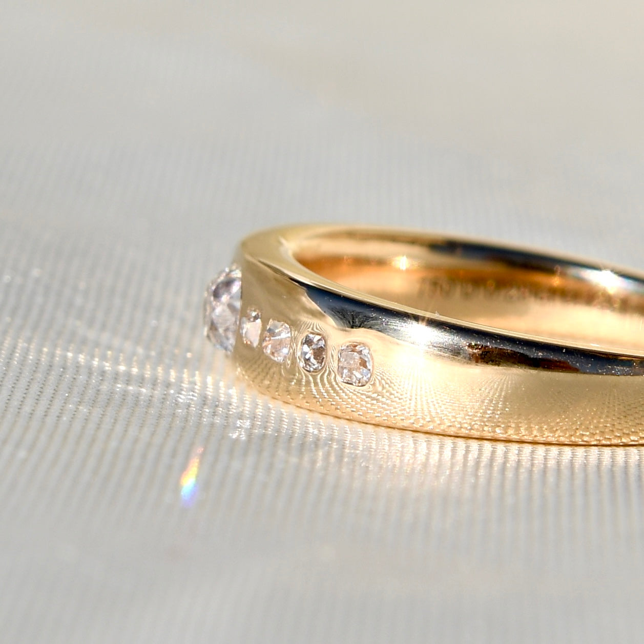 0.38 ct peruzzi cut diamond nine stone band ring