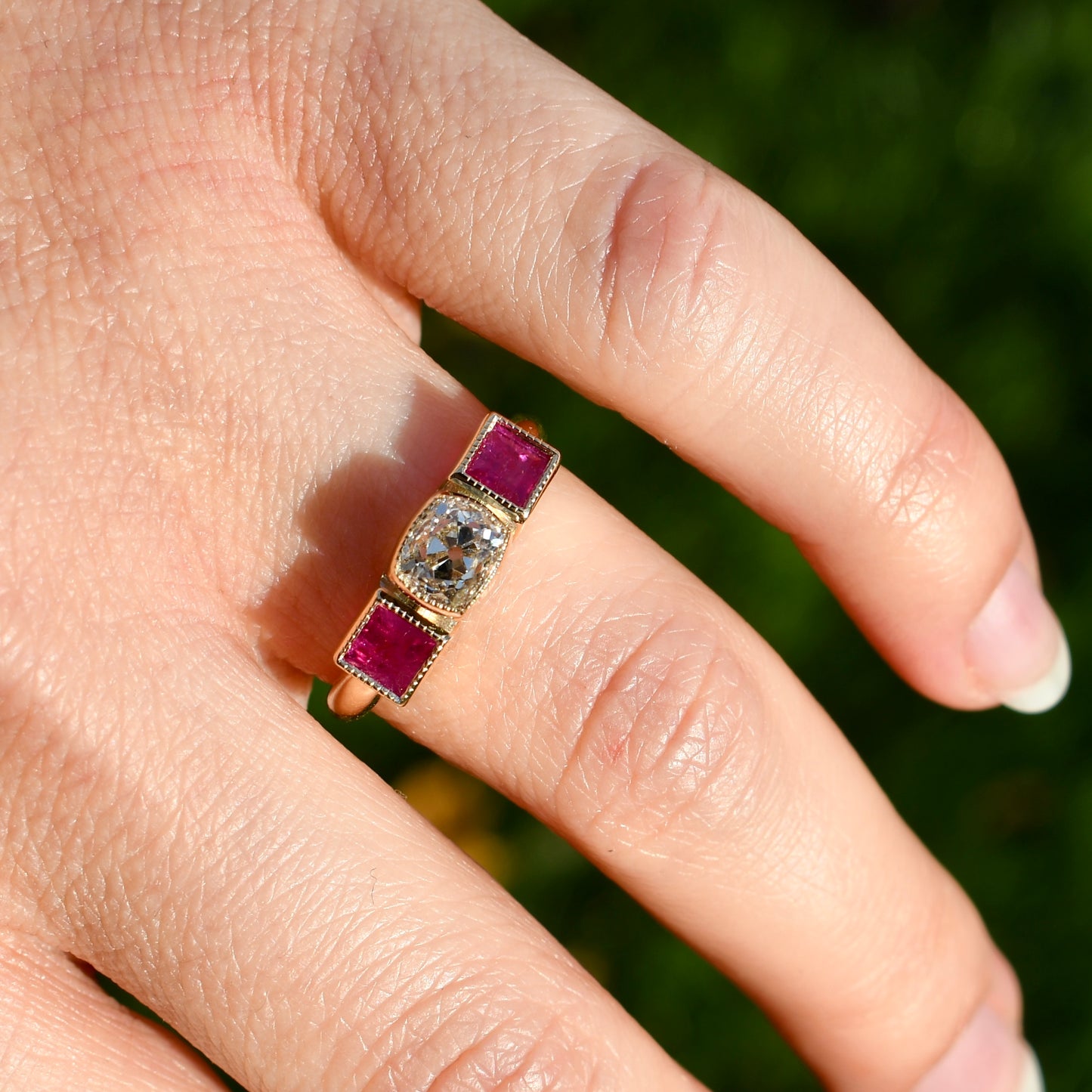 0.83 ct old mine cut diamond and ruby three stone ring