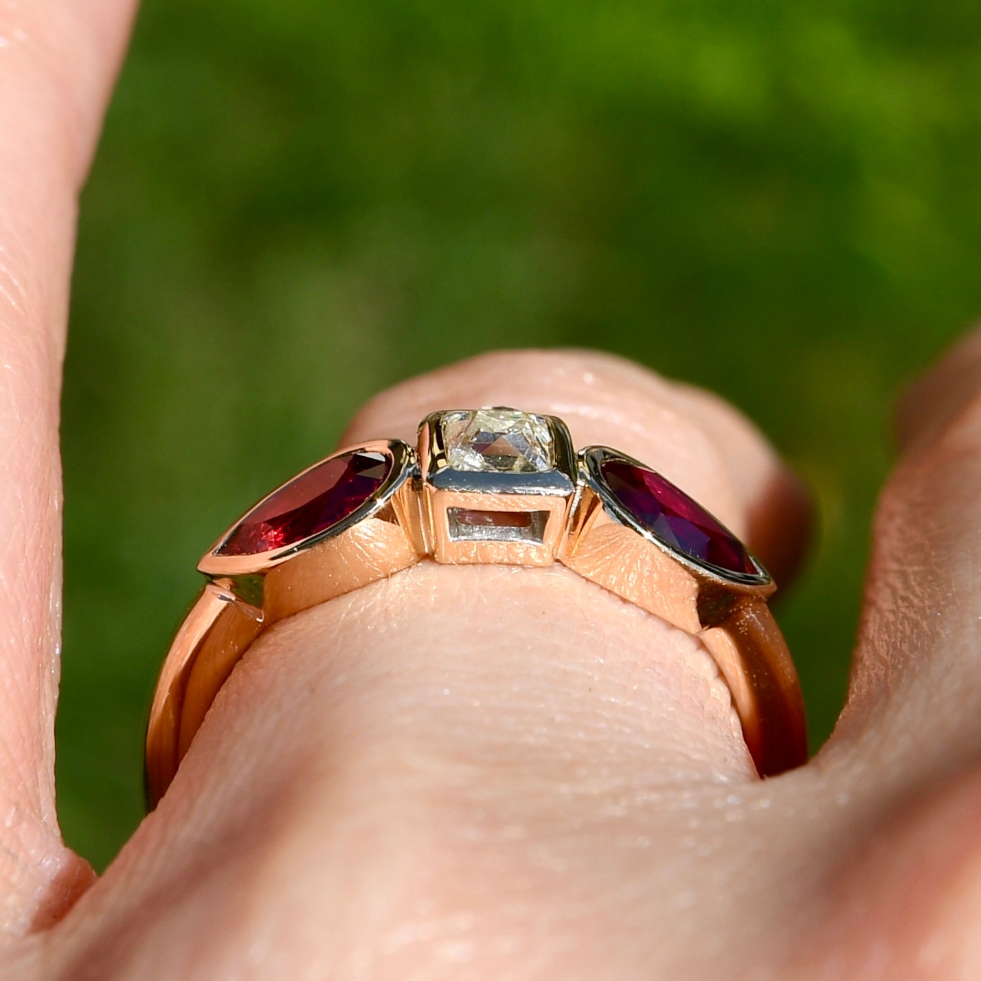 0.30 ct peruzzi cut diamond and pear ruby three stone ring