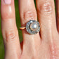 Antique natural pearl and 1.30 ct old mine cut diamond daisy ring