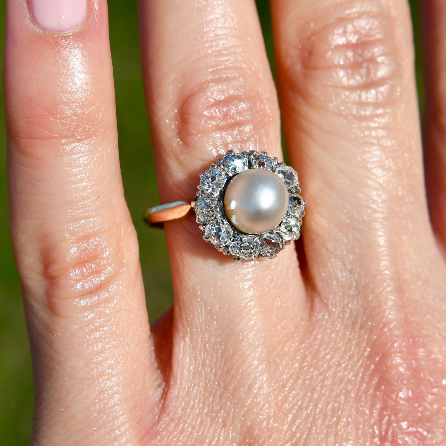 Antique natural pearl and 1.30 ct old mine cut diamond daisy ring