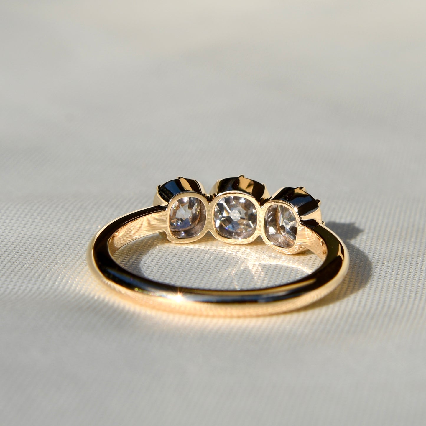0.53 ct old mine cut diamond three stone ring