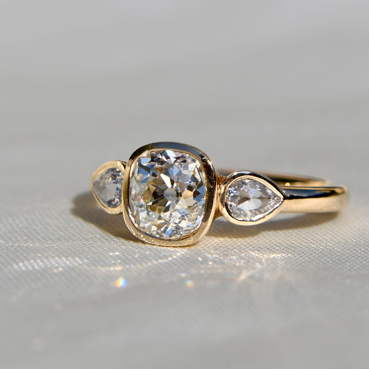 1.19 ct old mine and pear rose cut diamond three stone ring
