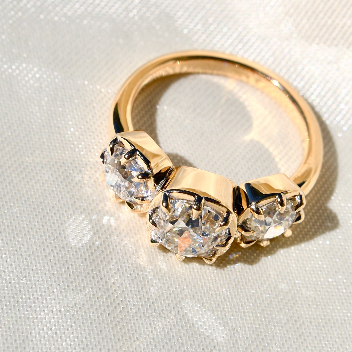 3.35 ct old mine cut diamond three stone ring