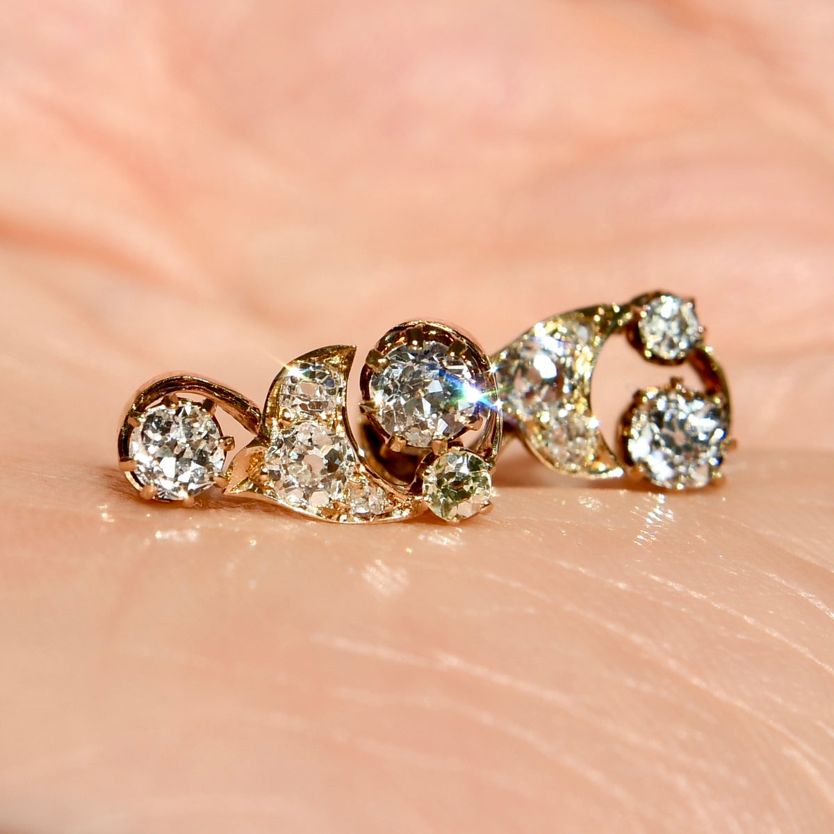 0.84 ct old mine cut diamond swirl stud earrings