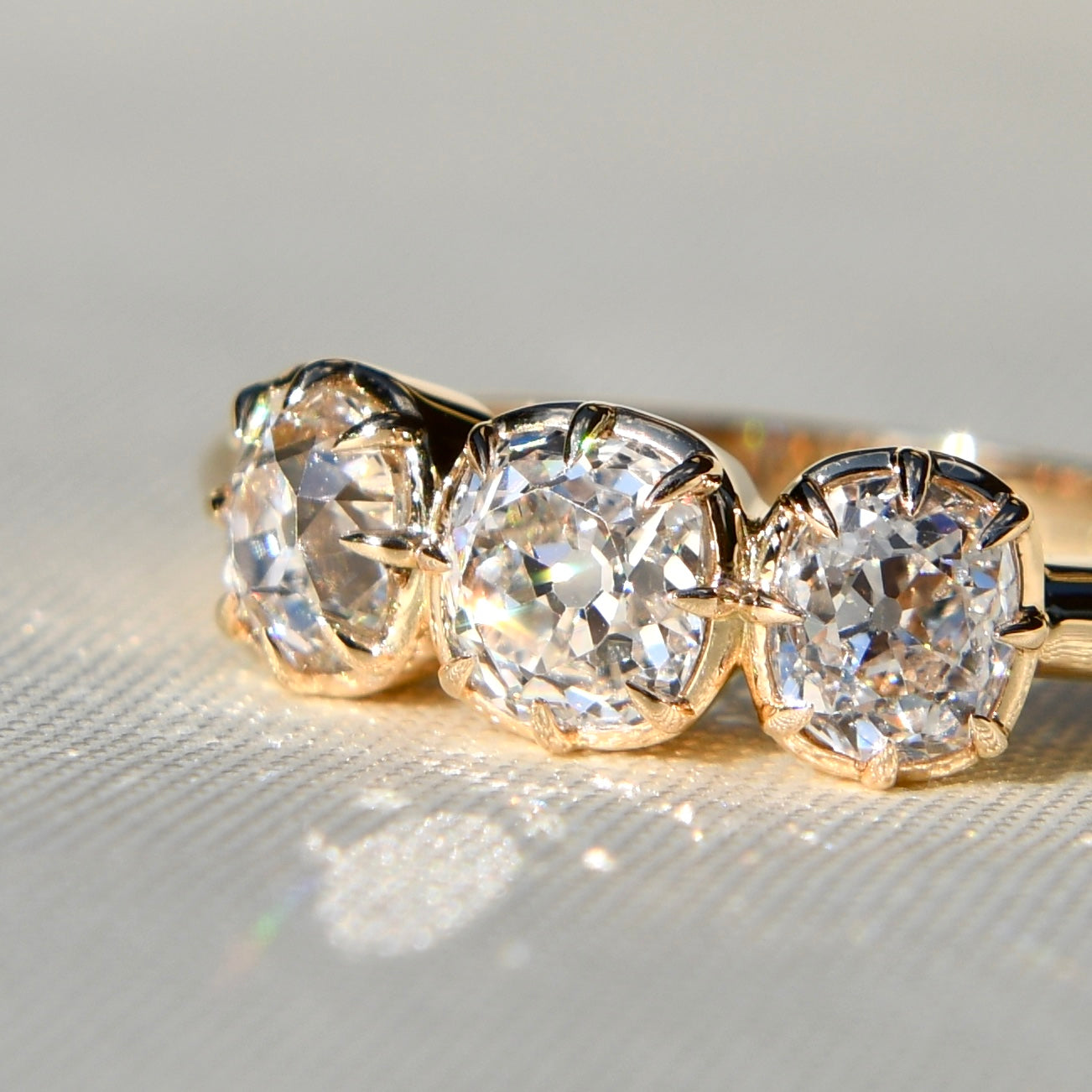 0.53 ct old mine cut diamond three stone ring