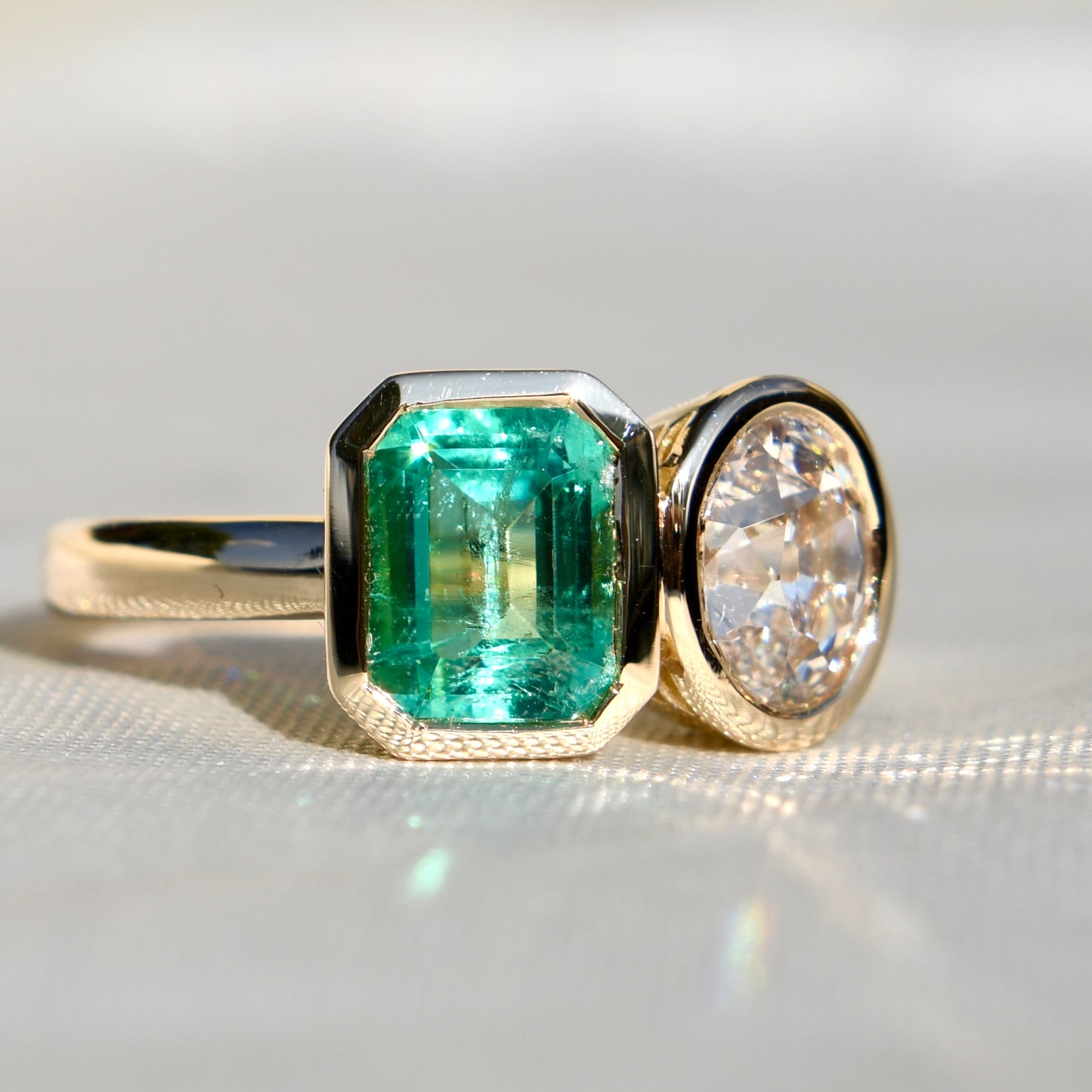 1.02 ct Colombian emerald and oval old mine cut diamond Toi et Moi ring