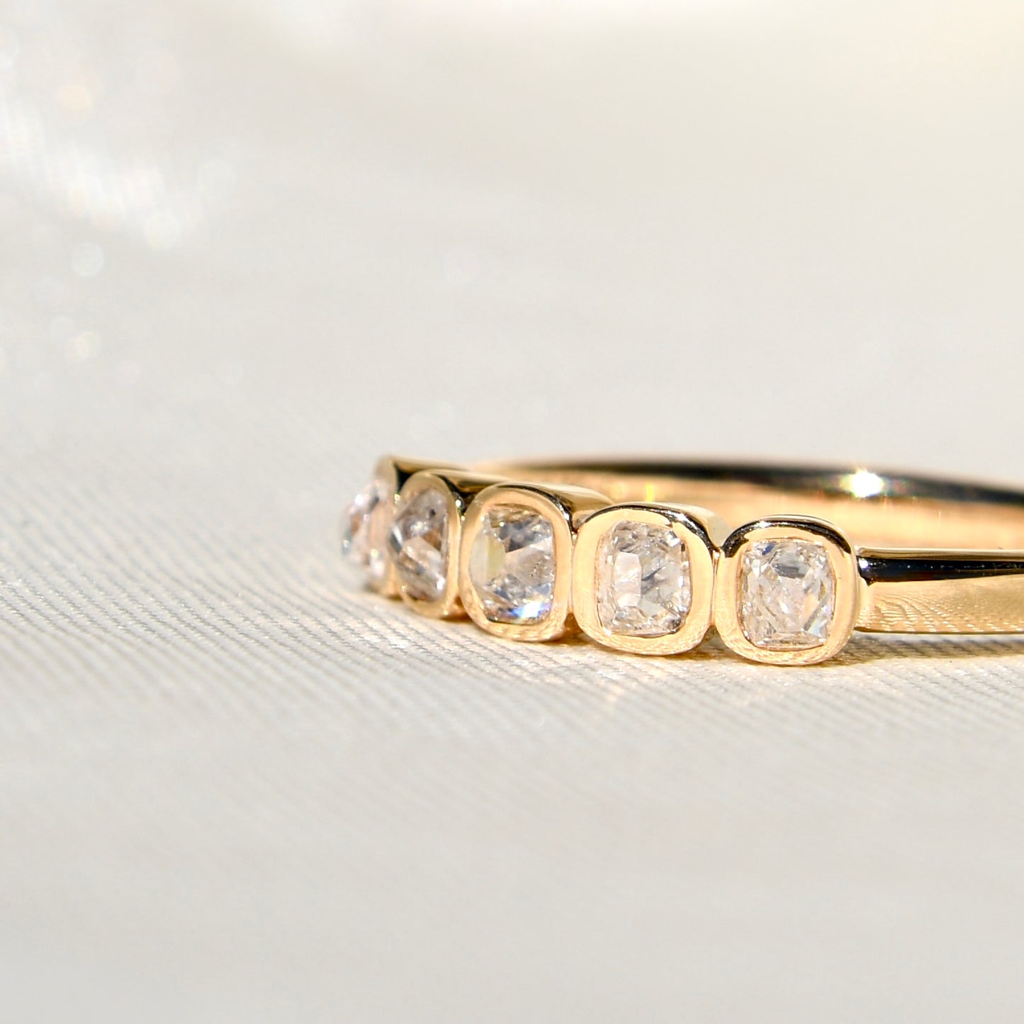 0.52 ct peruzzi cut diamond five stone band ring