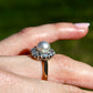 Antique natural pearl and 1.30 ct old mine cut diamond daisy ring