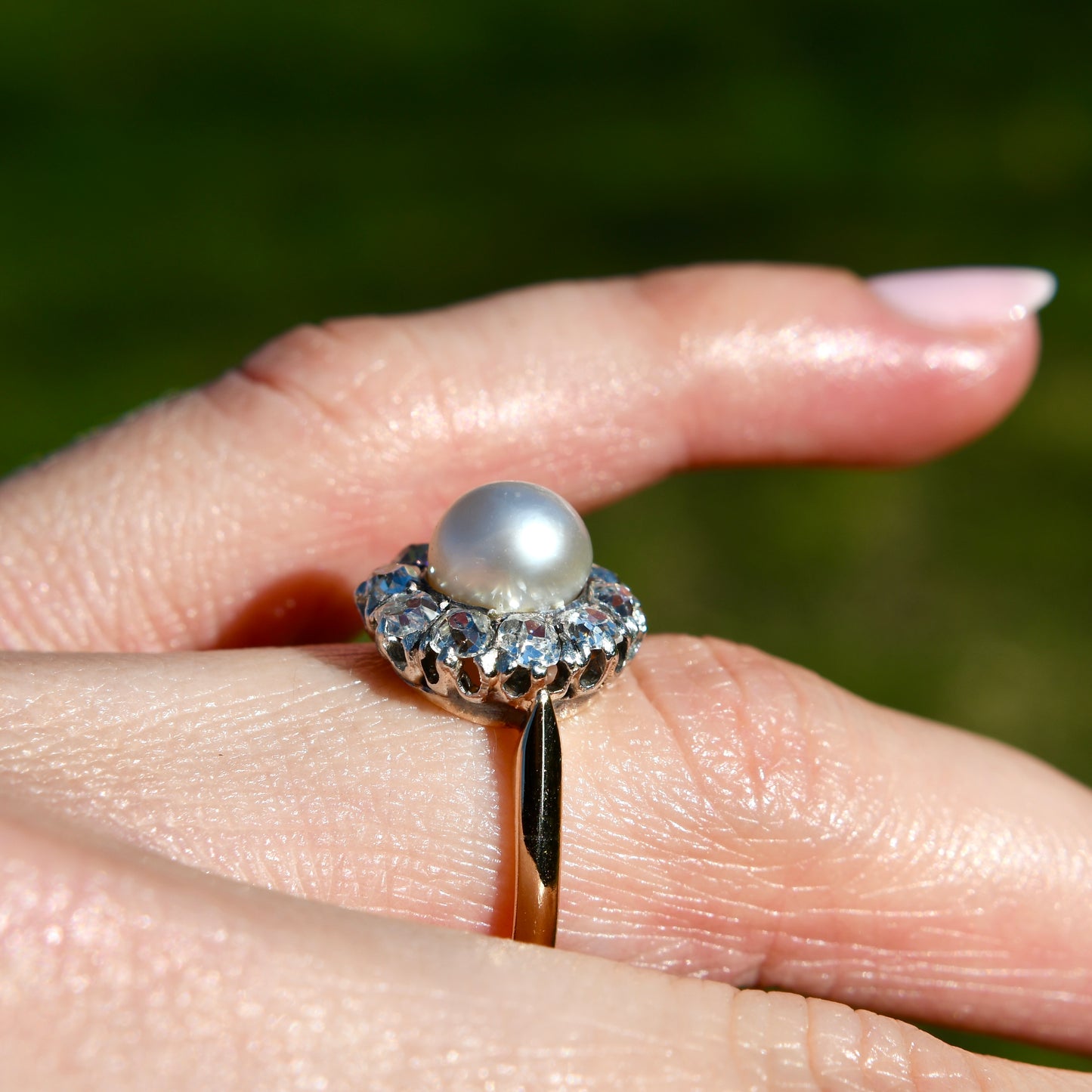 Antique natural pearl and 1.30 ct old mine cut diamond daisy ring