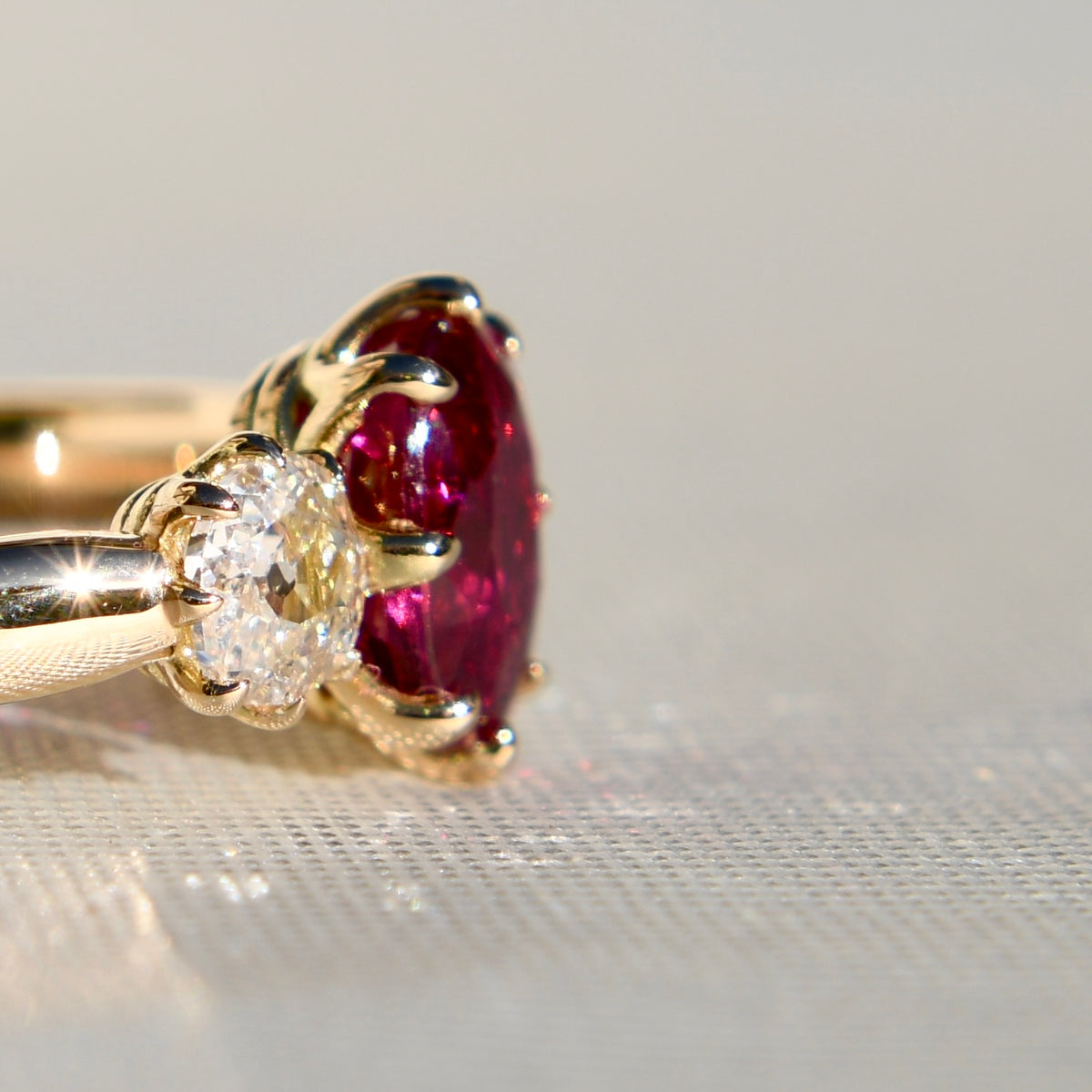1.03 ct ruby and old mine cut diamond three stone ring