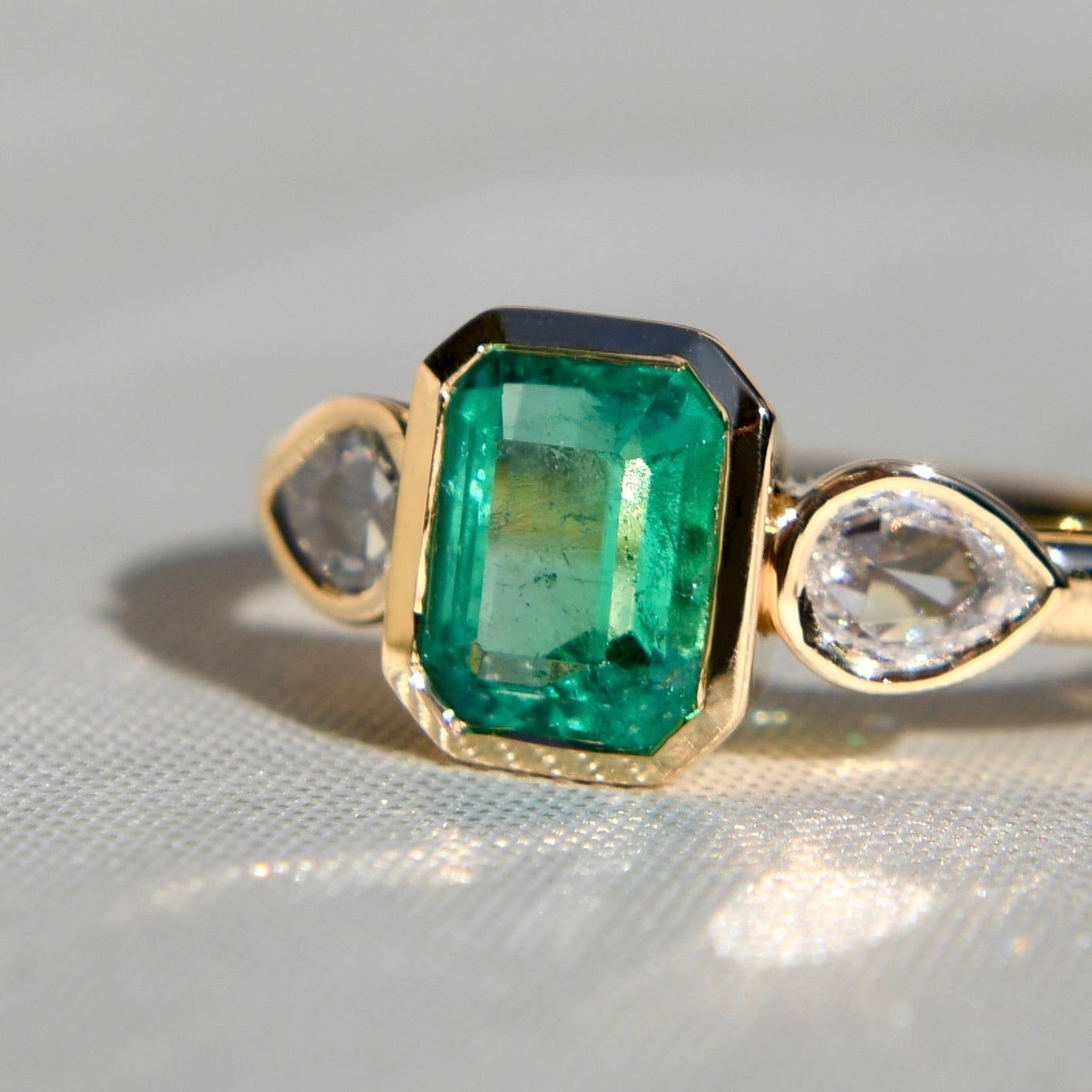0.91 ct Colombian emerald and pear rose cut diamond three stone ring