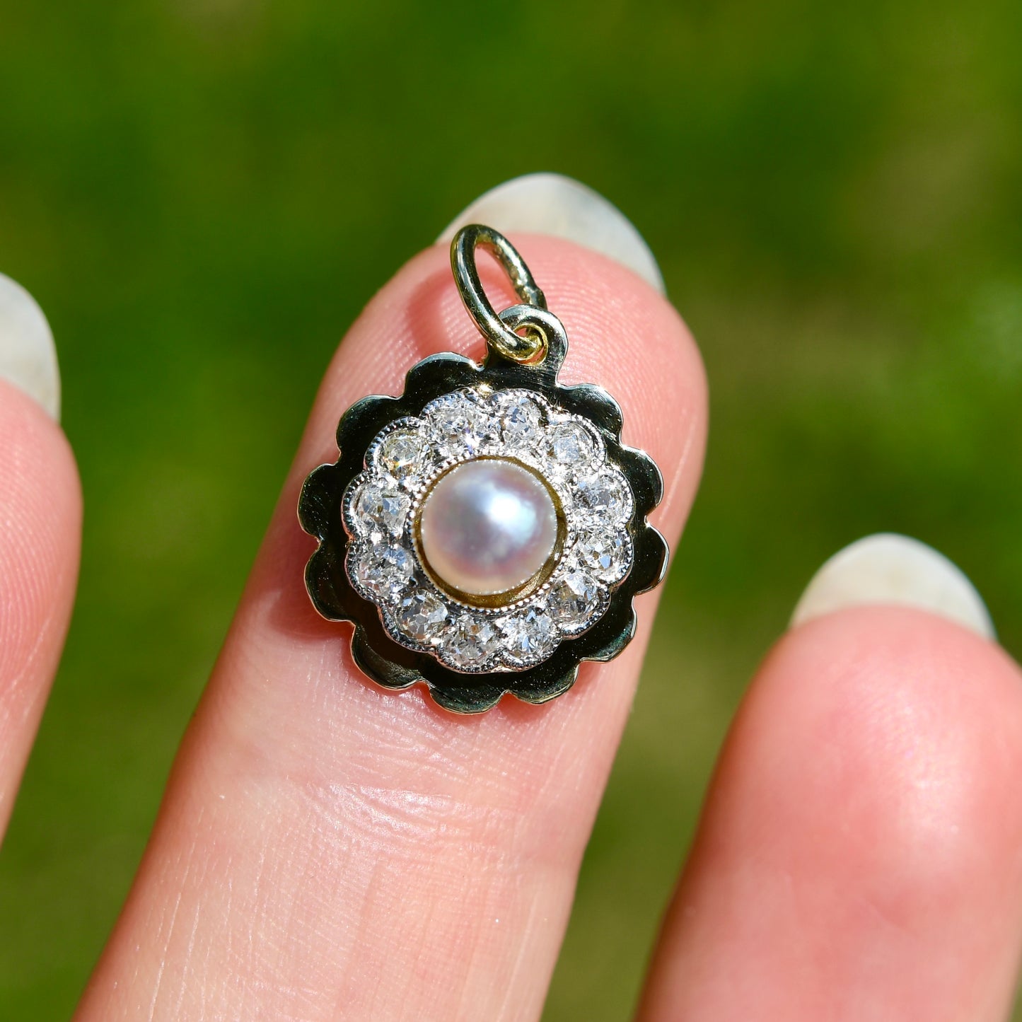 Antique natural pearl and 0.24 ct old mine cut diamond daisy pendant