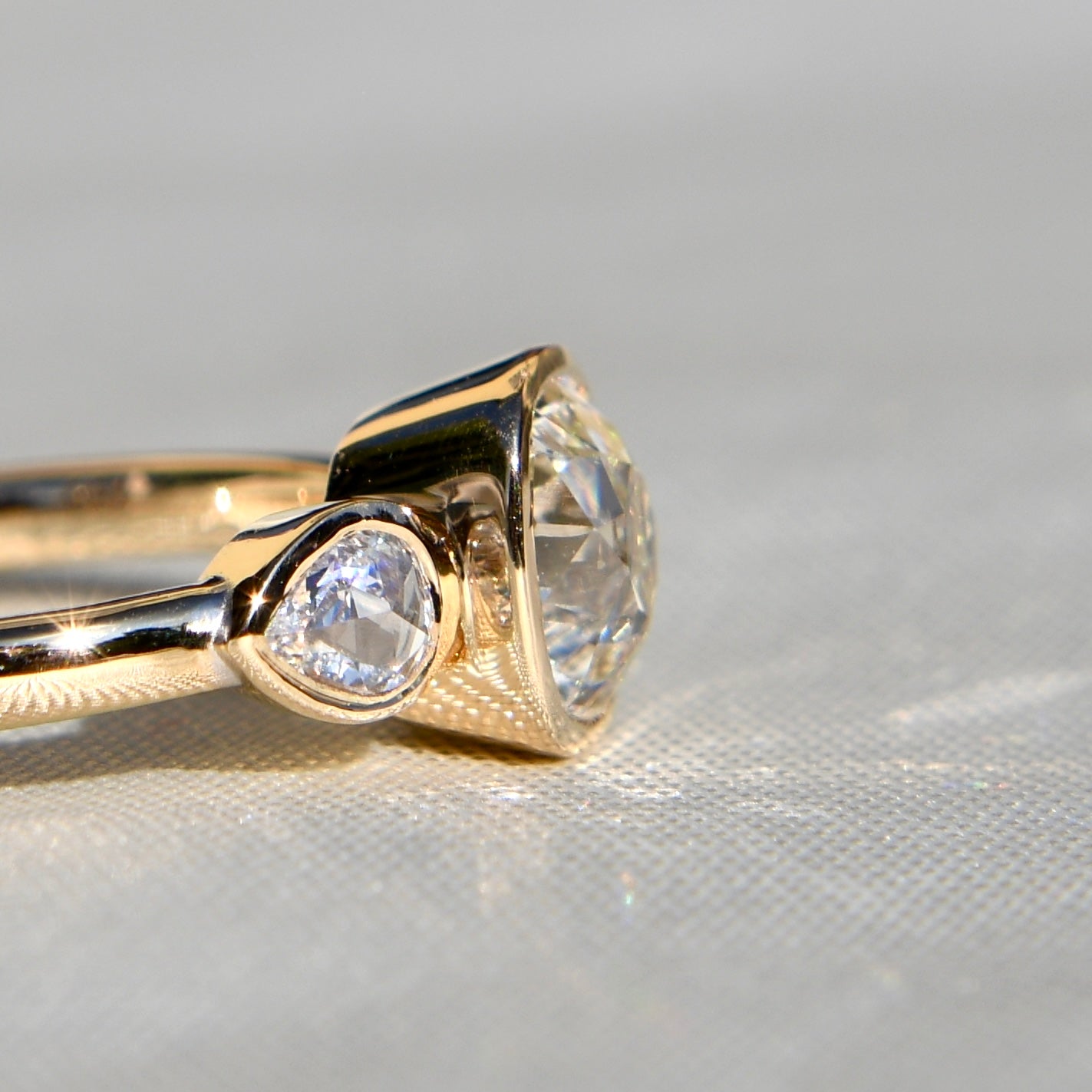 1.19 ct old mine and pear rose cut diamond three stone ring