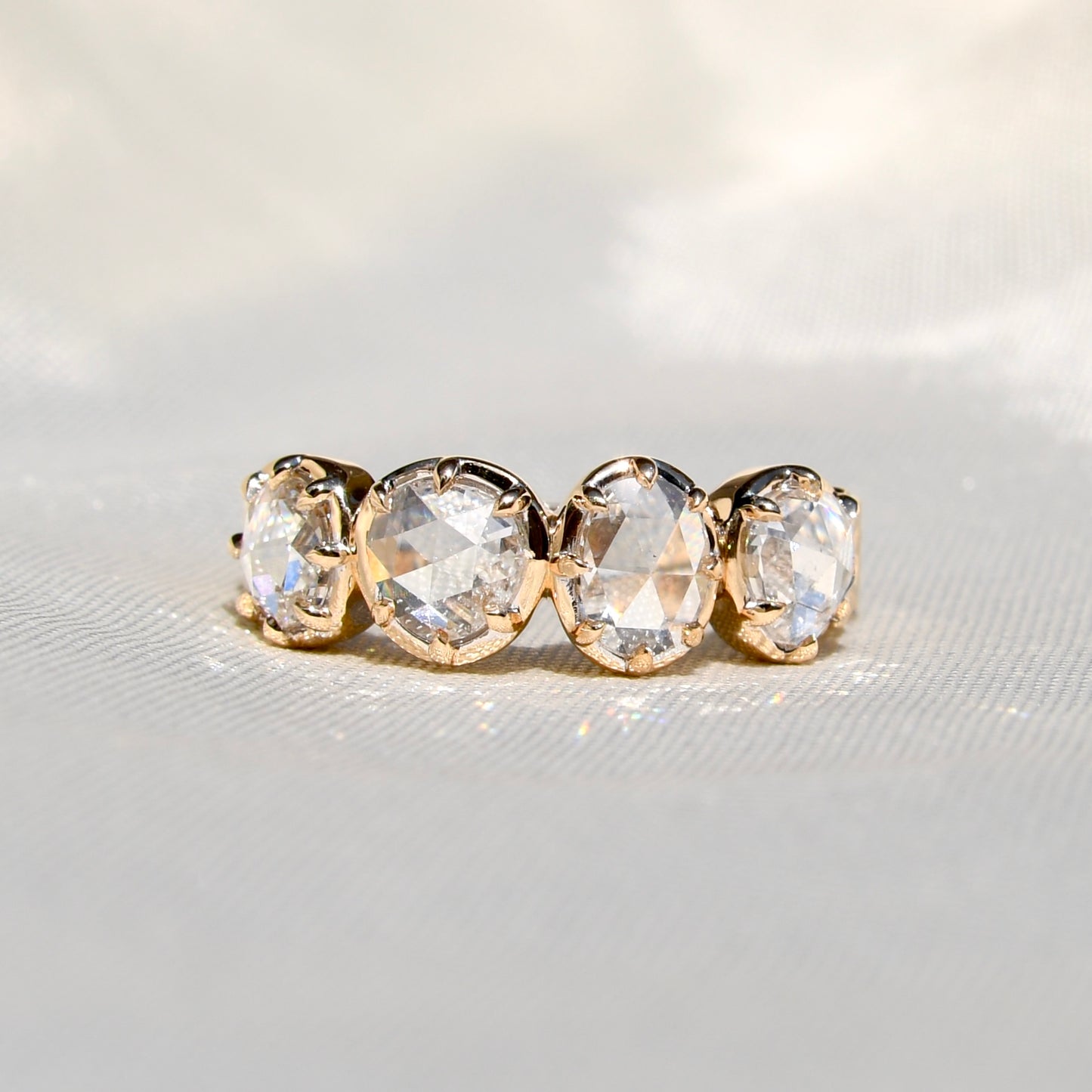 1.30 ct rose cut diamond four stone band ring
