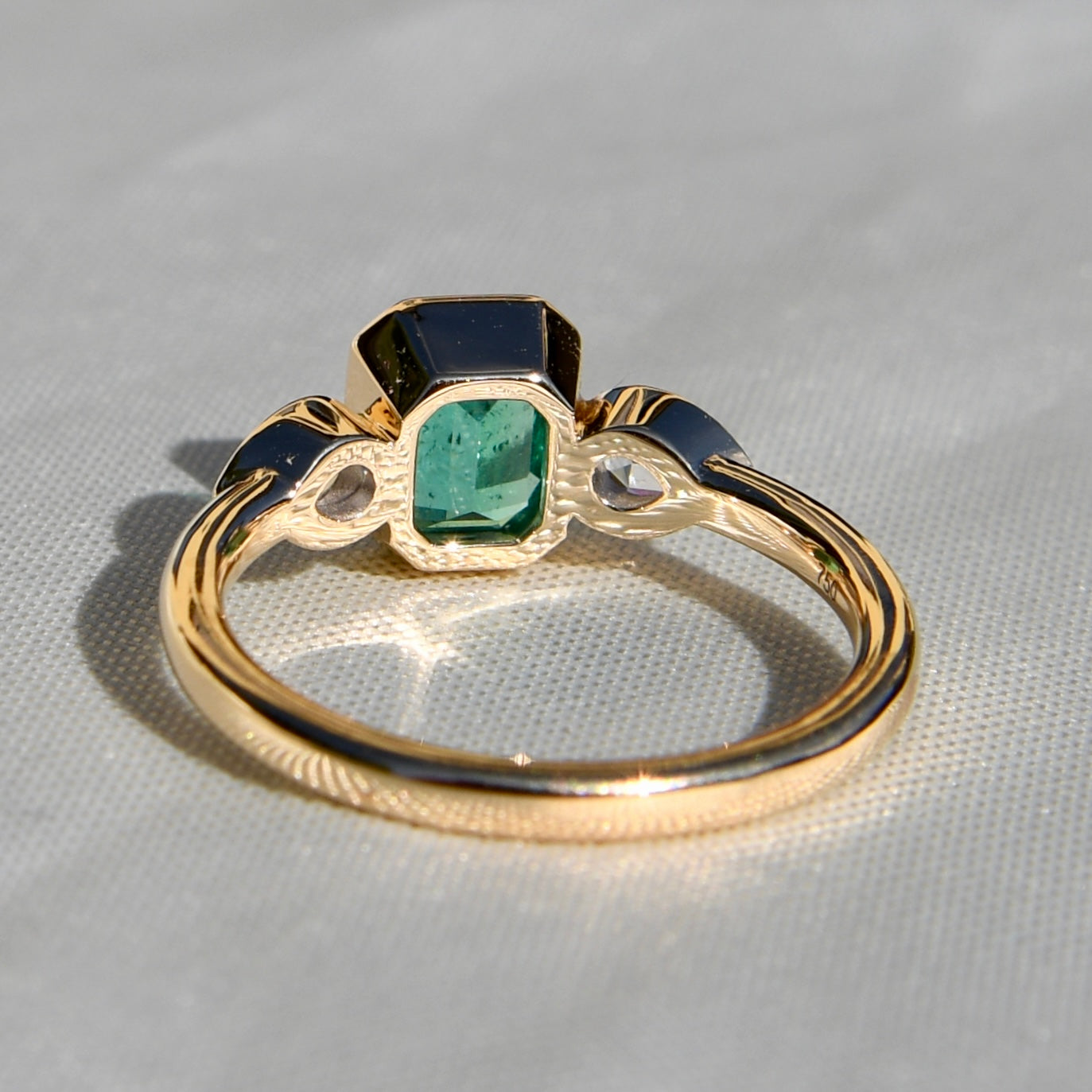 0.91 ct Colombian emerald and pear rose cut diamond three stone ring