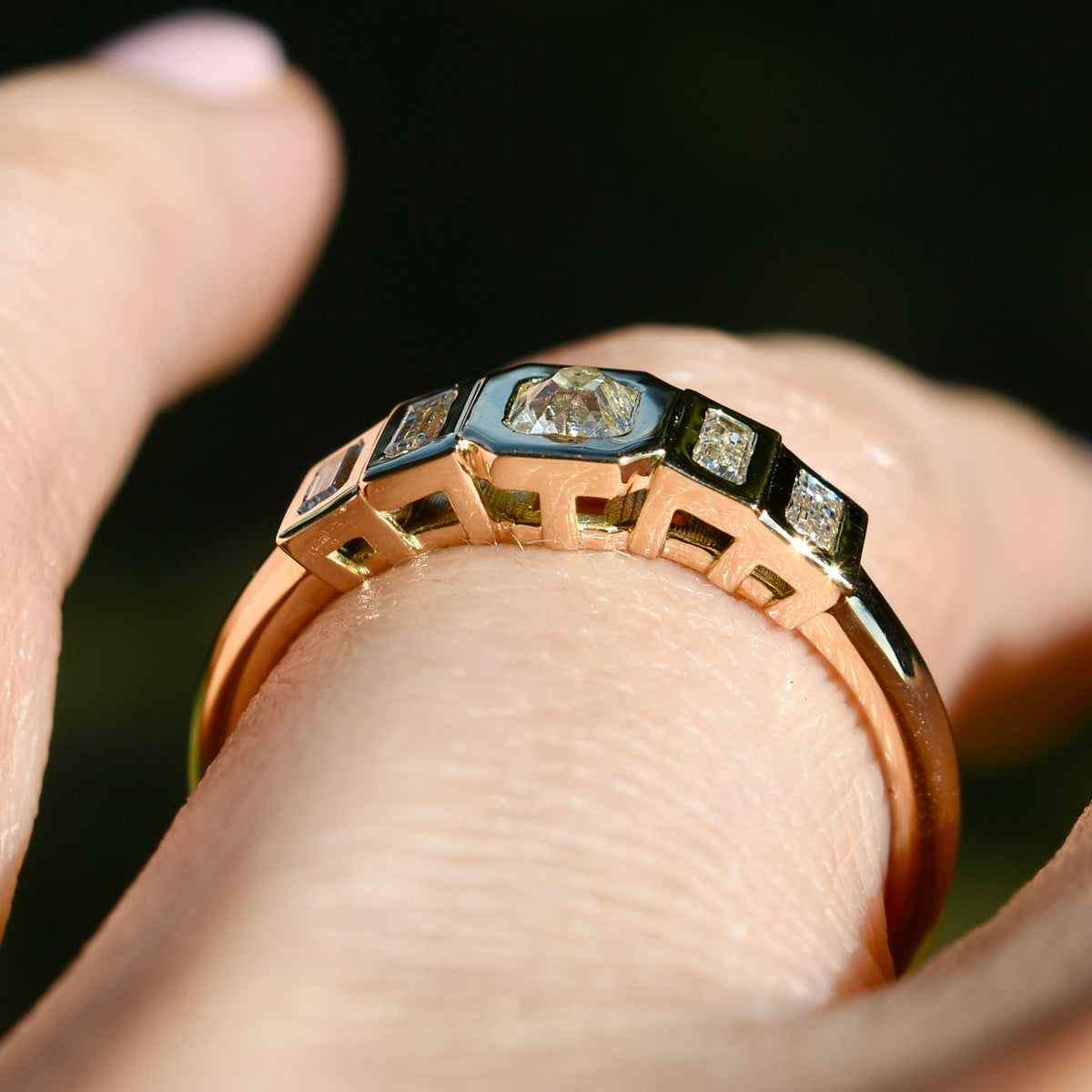 0.23 ct peruzzi and baguette cut diamond five stone ring