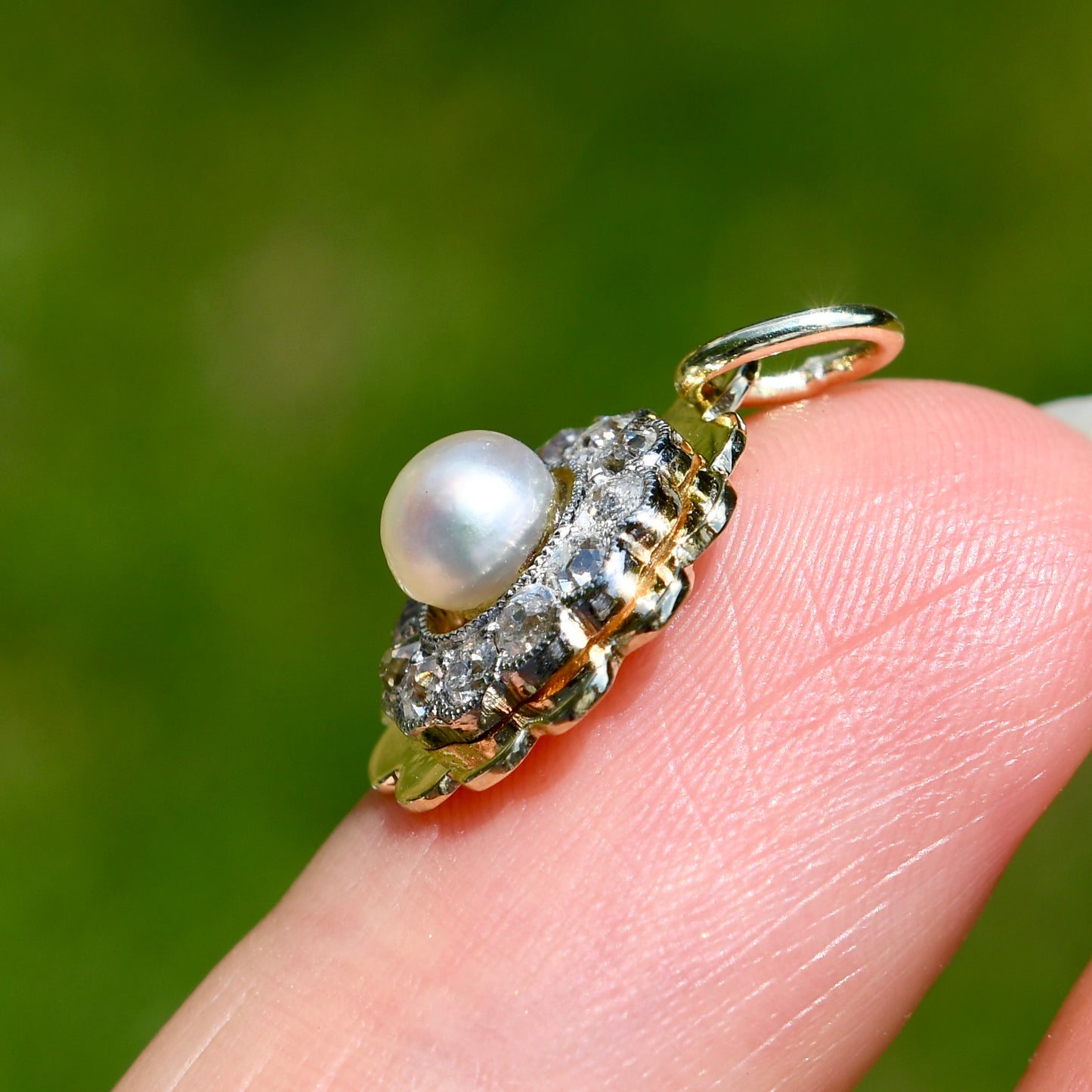 Antique natural pearl and 0.24 ct old mine cut diamond daisy pendant