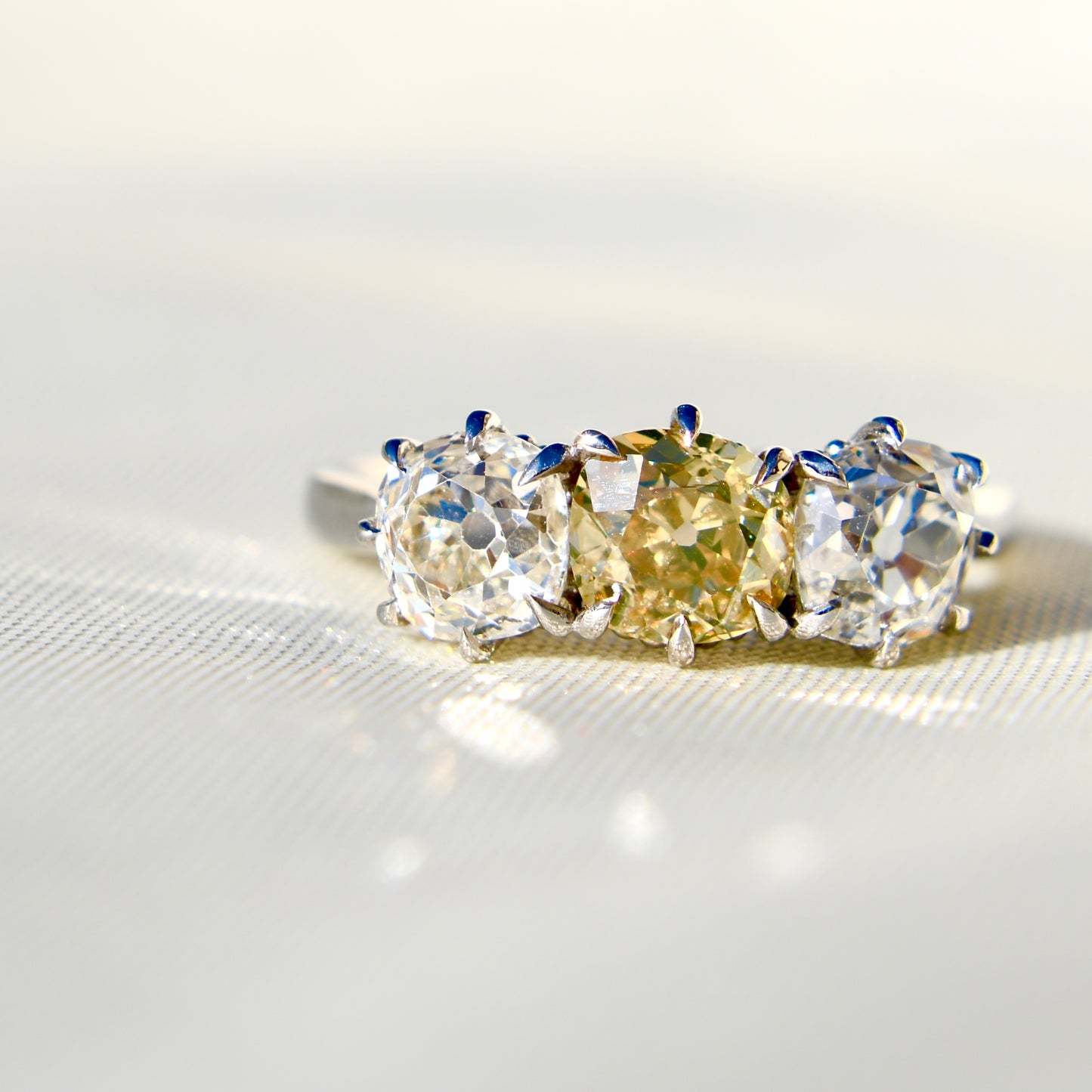 2.66 ct old mine cut diamond three stone ring