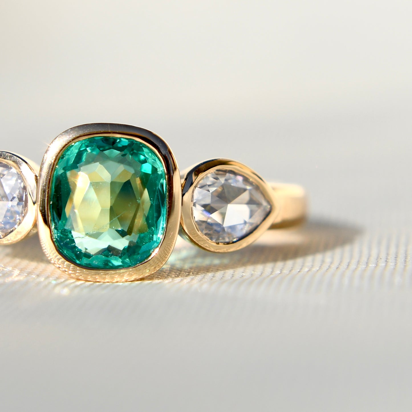 0.80 ct Colombian emerald and pear rose cut diamond three stone ring