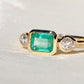 0.69 ct Colombian emerald and old pear cut diamond three stone ring