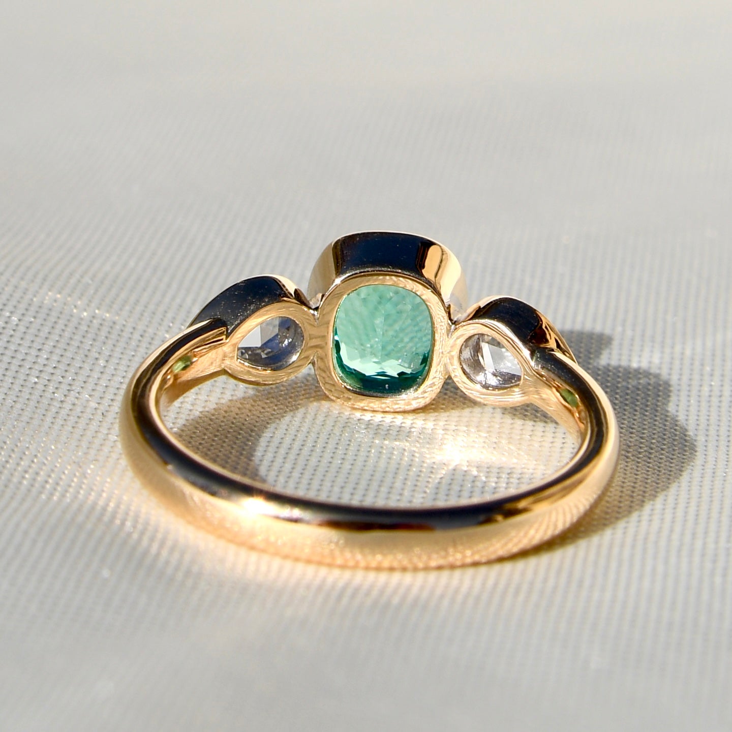 0.80 ct Colombian emerald and pear rose cut diamond three stone ring