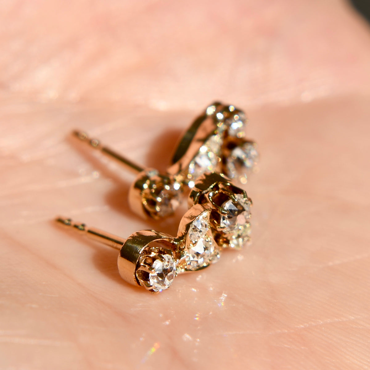 0.84 ct old mine cut diamond swirl stud earrings