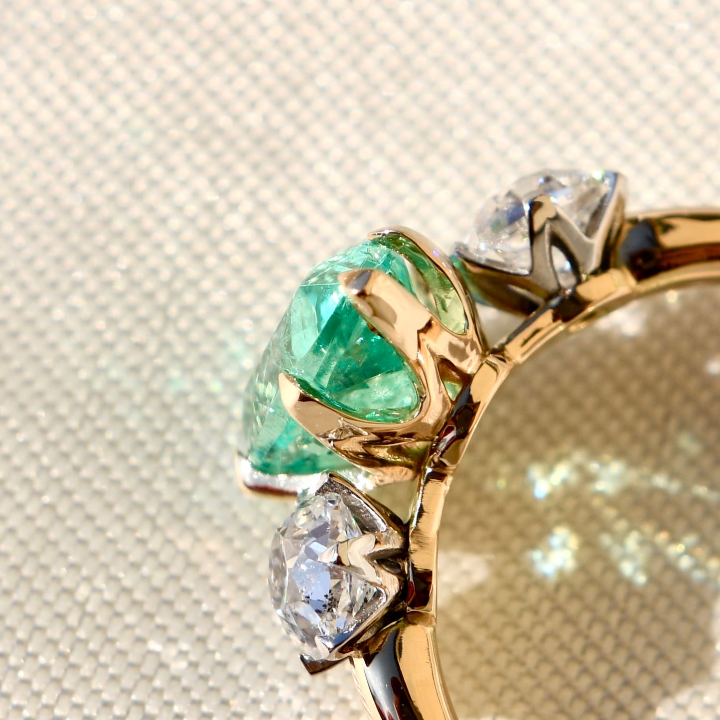 1.66 ct Colombian emerald and old mine cut diamond three stone ring