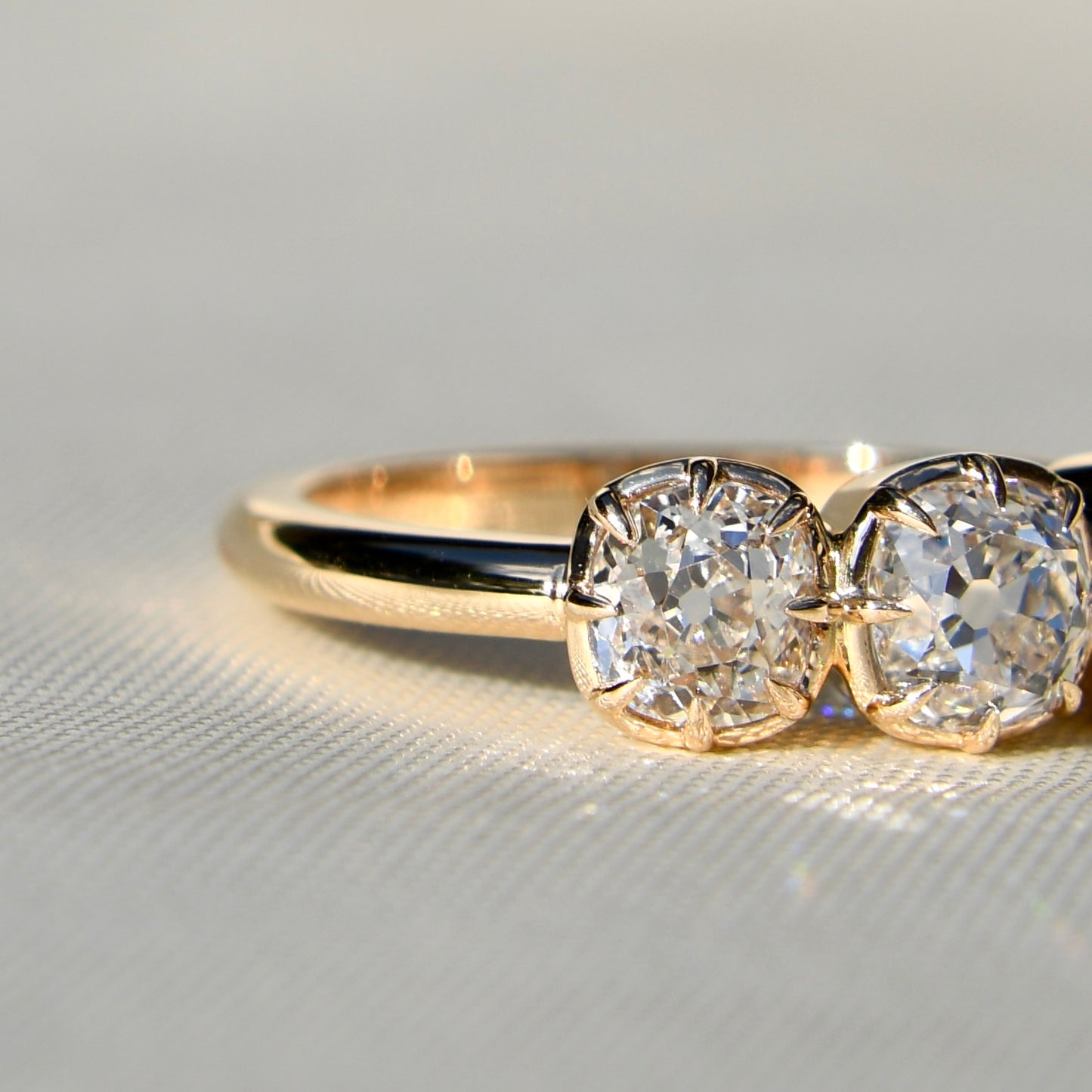 0.53 ct old mine cut diamond three stone ring