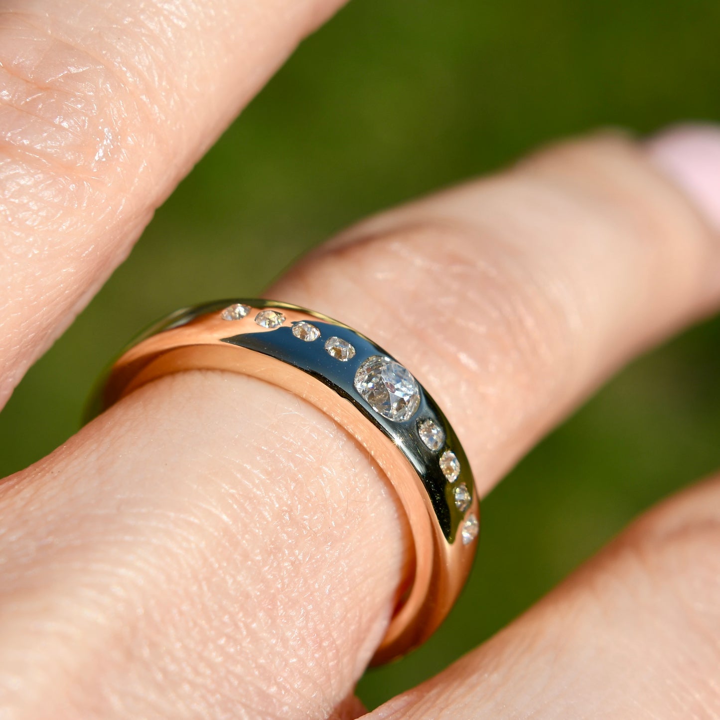 0.38 ct peruzzi cut diamond nine stone band ring