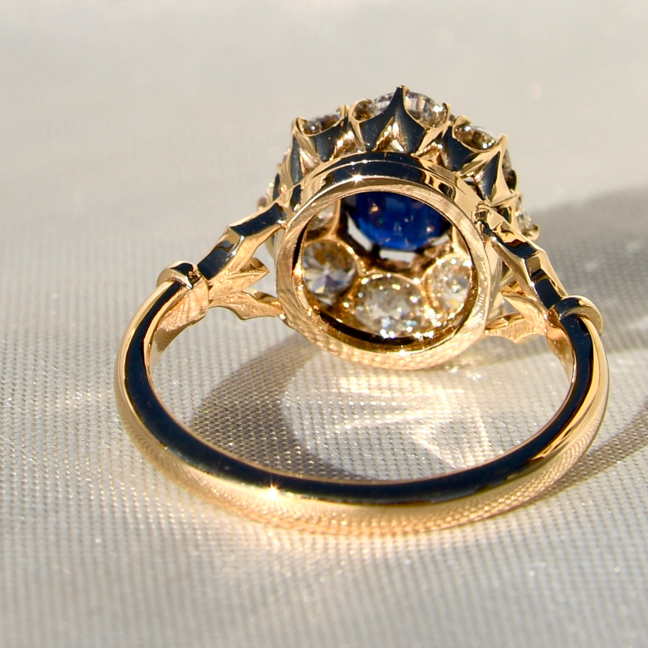 1.15 ct sapphire and old mine cut diamond cluster ring