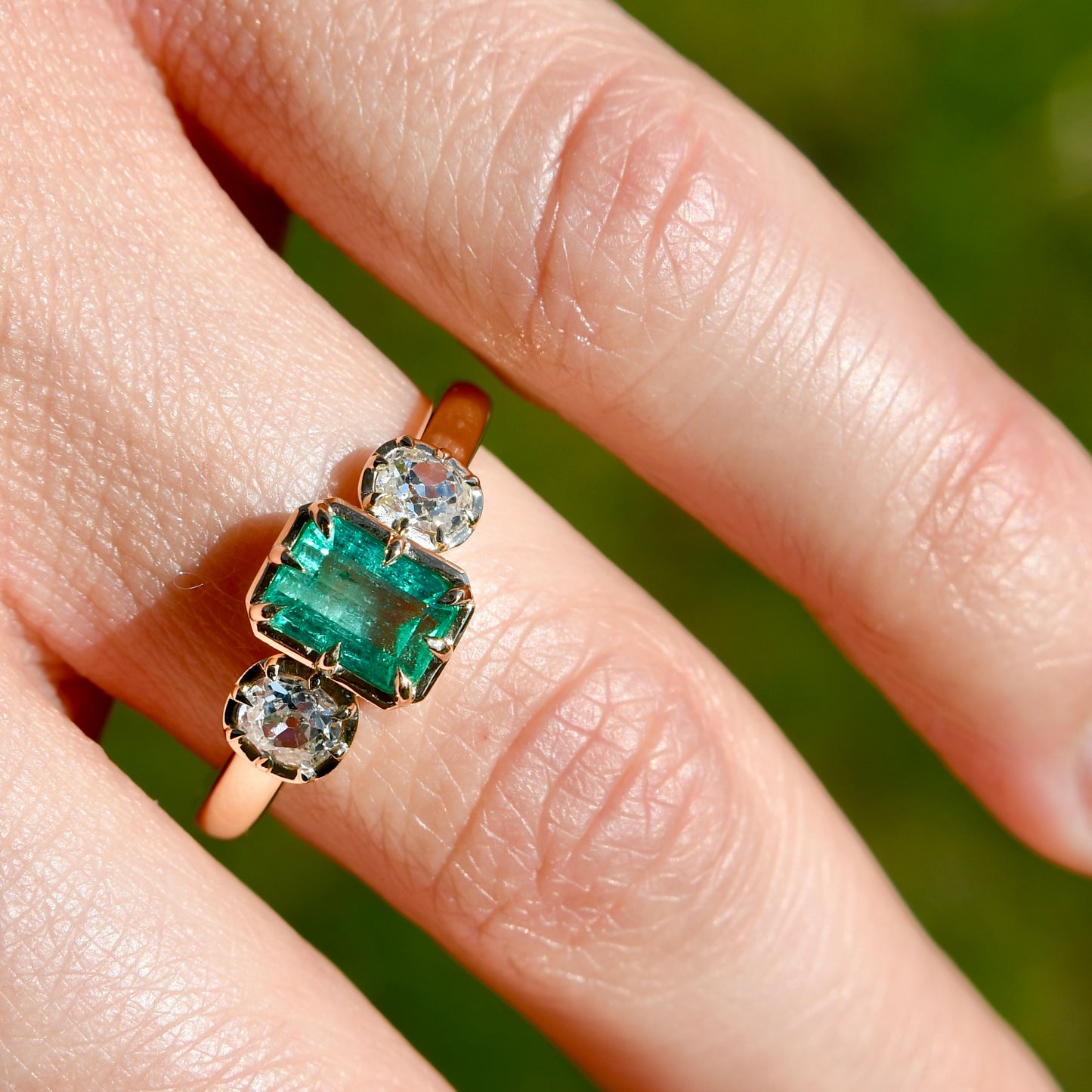 0.93 ct Colombian emerald and old mine cut diamond three stone ring