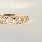 0.67 ct peruzzi cut diamond nine stone band ring