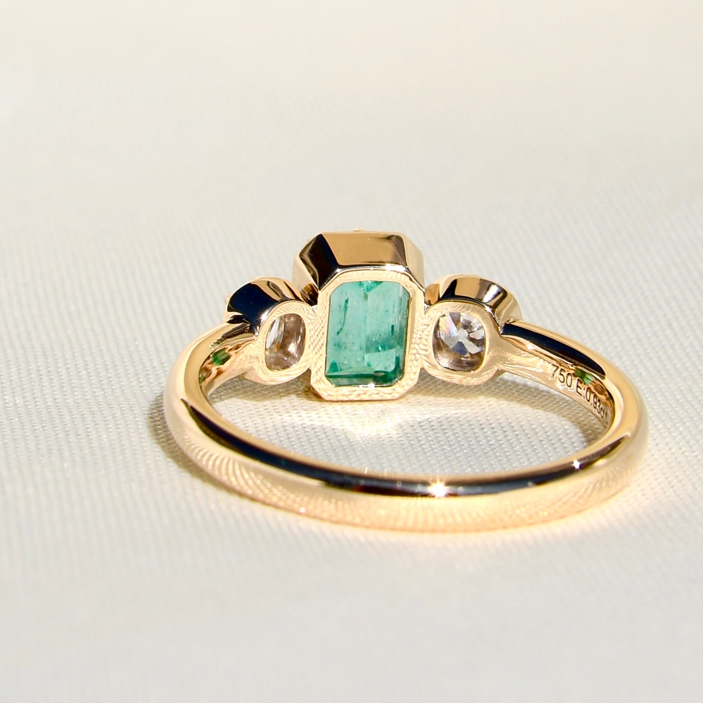 0.93 ct Colombian emerald and old mine cut diamond three stone ring