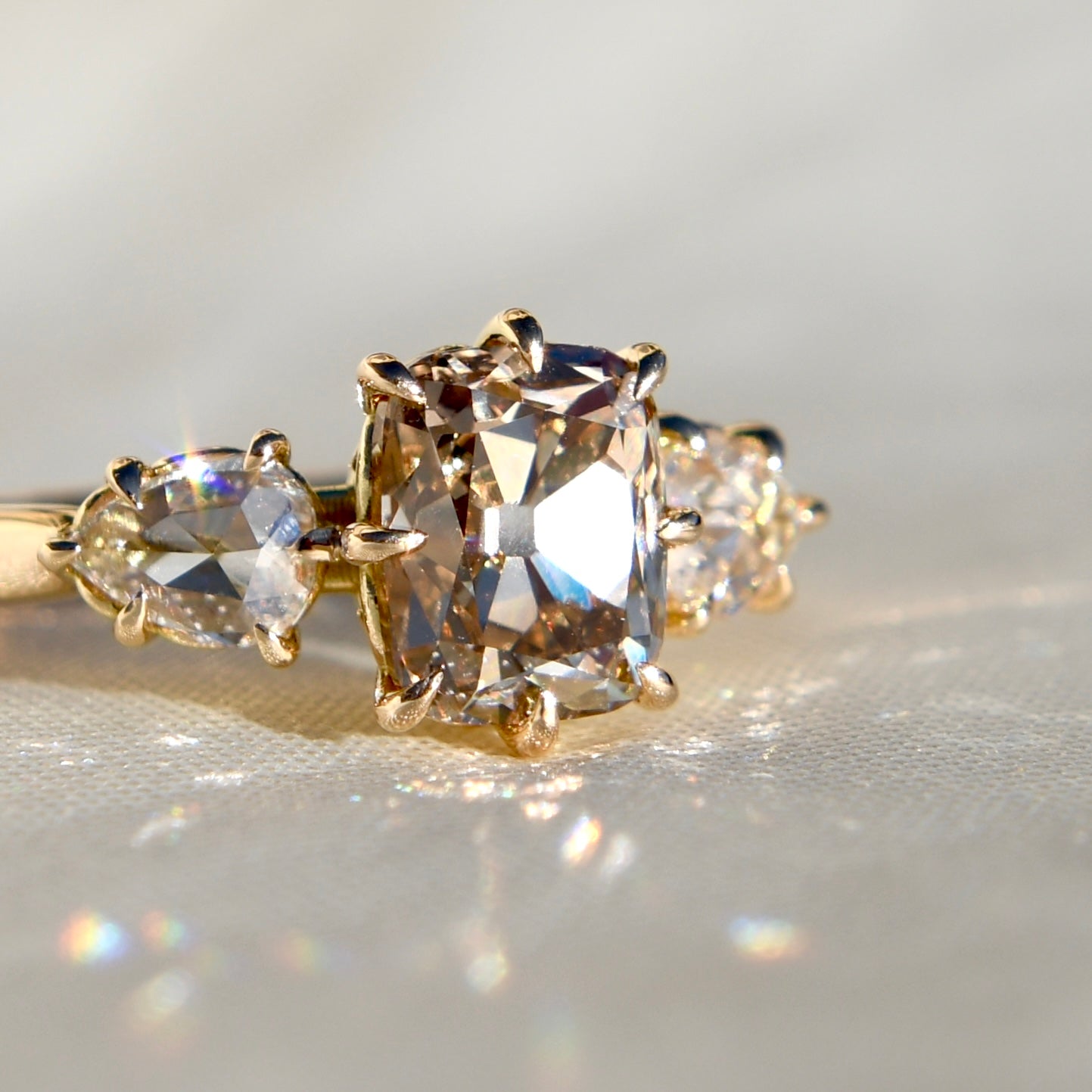 2.03 ct old mine and pear rose cut diamond three stone ring