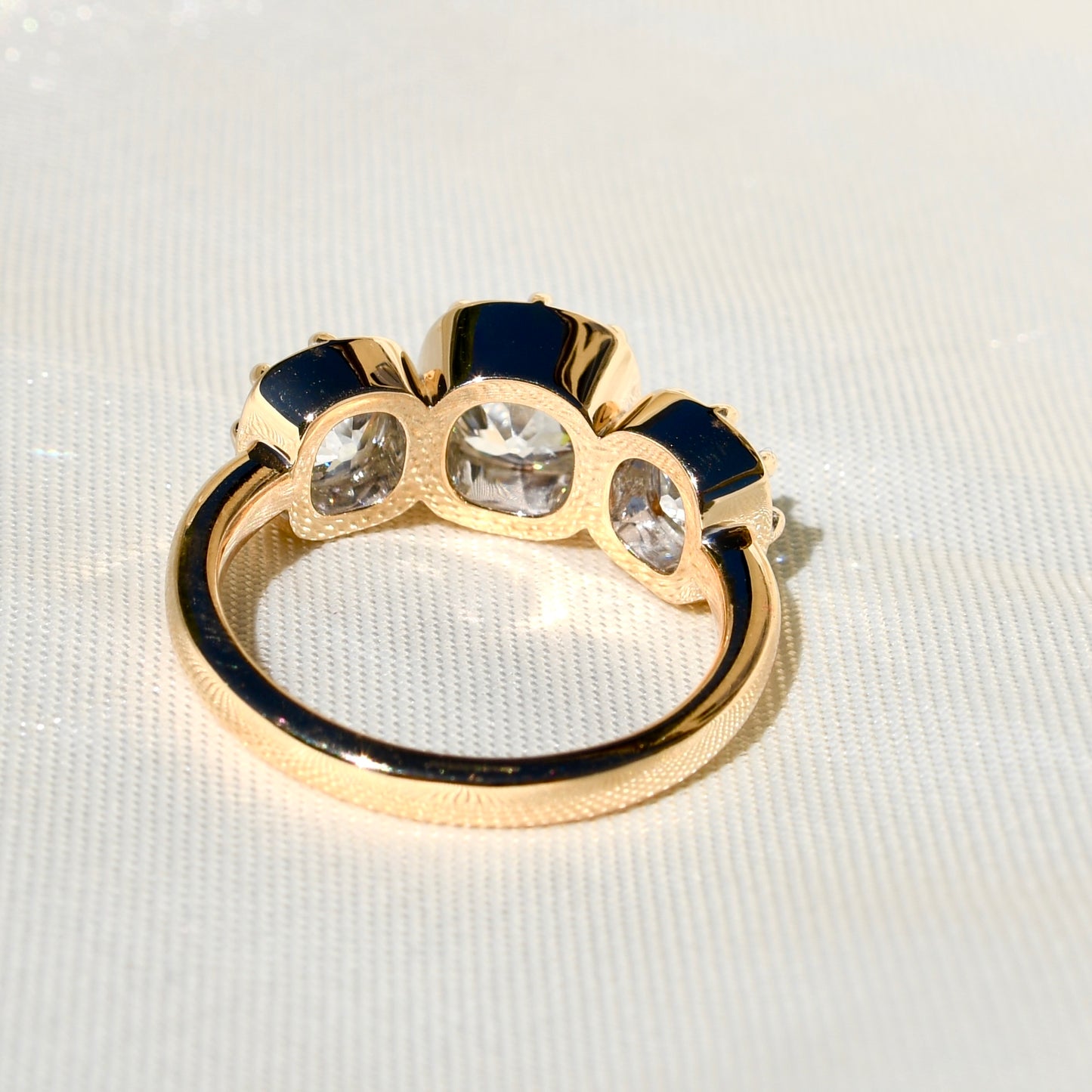 3.35 ct old mine cut diamond three stone ring