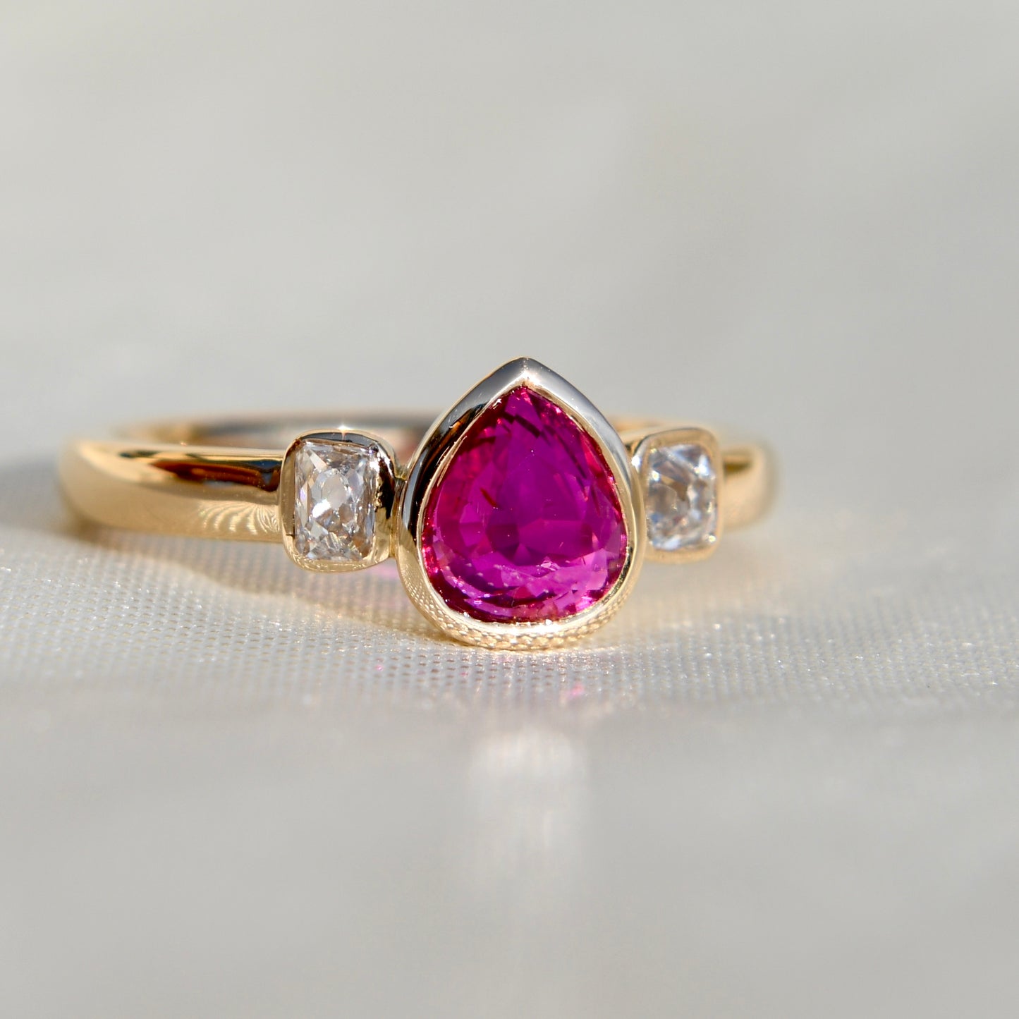 1.01 ct ruby and peruzzi cut diamond three stone ring