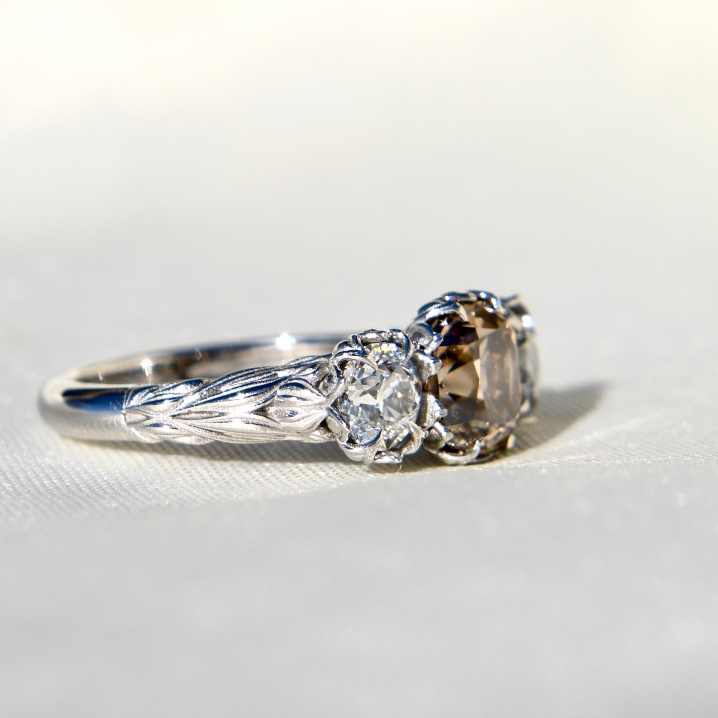 2.97 ct old mine and old European cut diamond tulip three stone ring