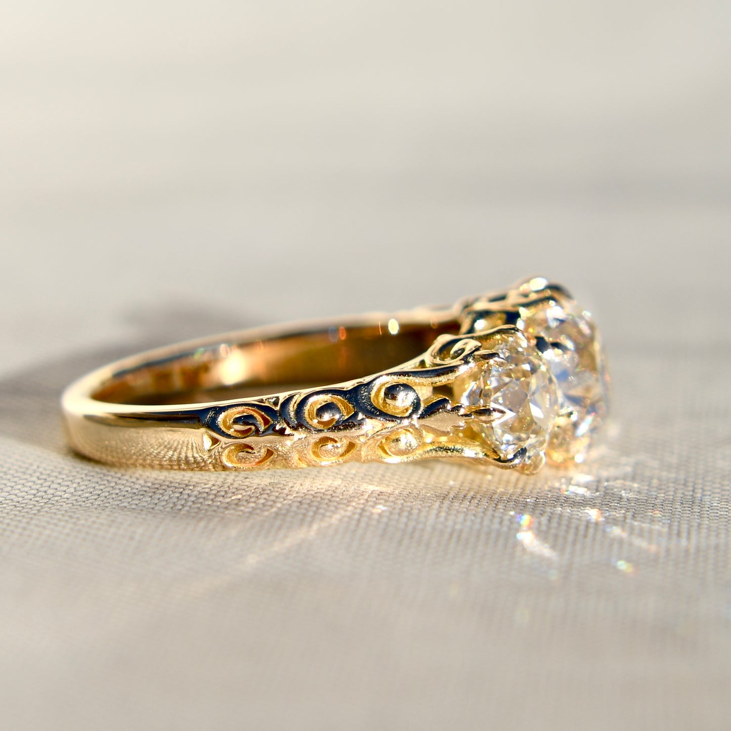 1.62 ct old mine and old European cut diamond three stone ring