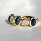 0.66ct old European cut diamond and sapphire cabochon five stone ring
