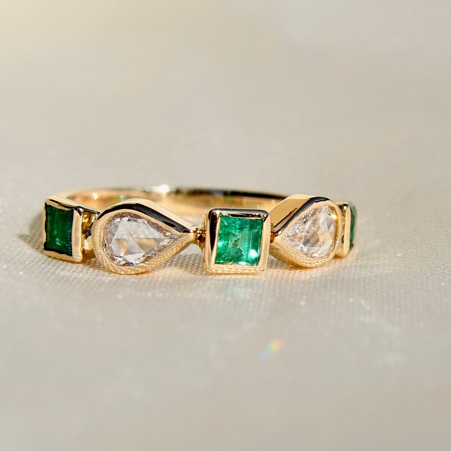0.40ct rose cut diamond and emerald five stone ring