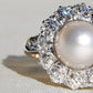 Antique Belle Époque natural pearl and 1.74 ct old European cut diamond daisy ring