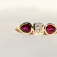 0.30 ct peruzzi cut diamond and pear ruby three stone ring