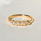 0.52 ct peruzzi cut diamond five stone band ring
