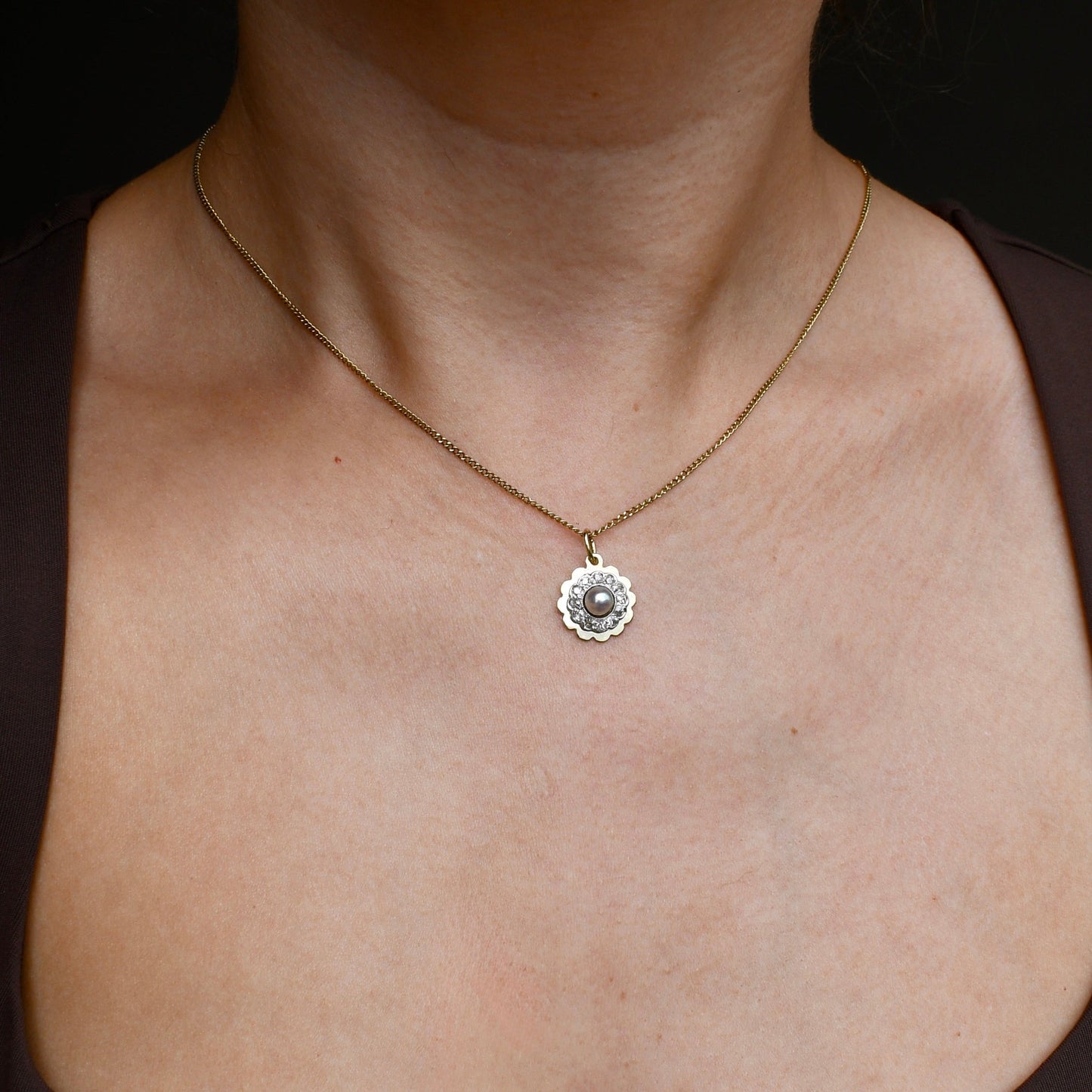 Antique natural pearl and 0.24 ct old mine cut diamond daisy pendant